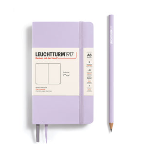 Leuchtturm1917 notebook and pencil on a white background