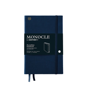 Blue notebook with Monocle branding on a white background