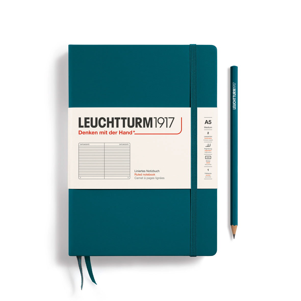 Teal notebook with Leuchtturm1917 branding and a pencil on a white background