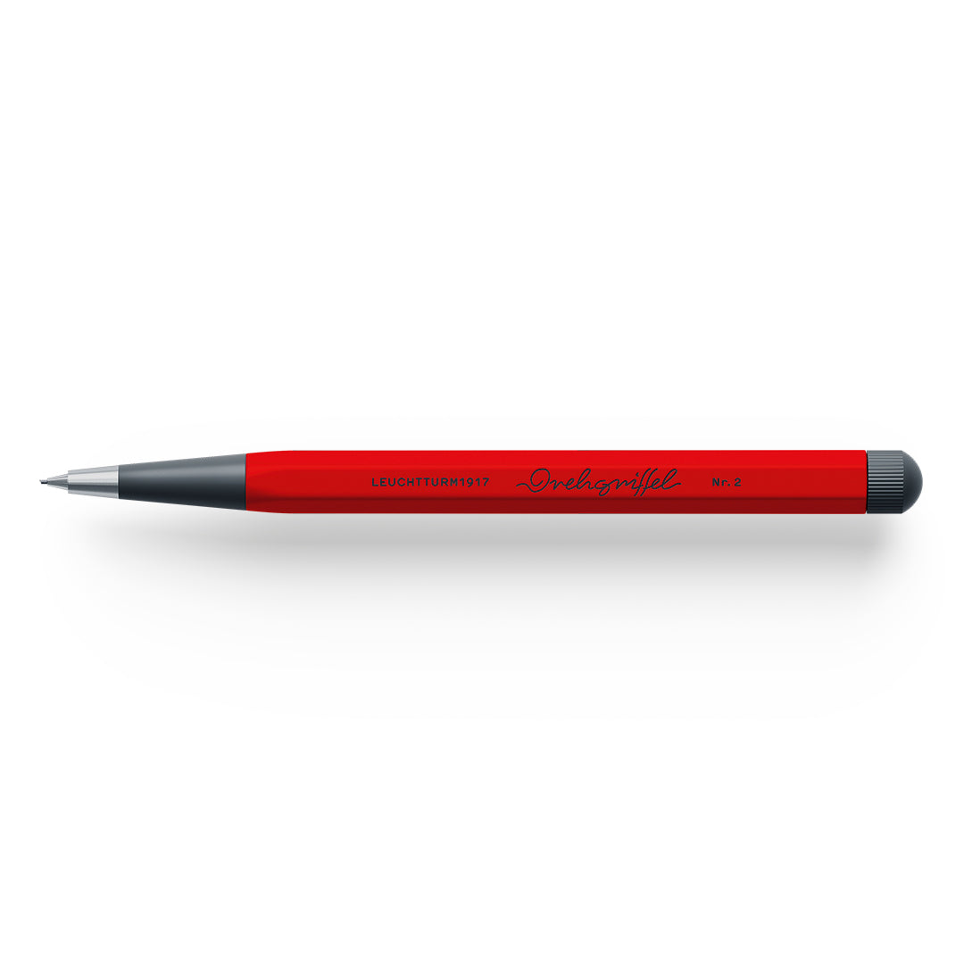 Red pencil with black accents on a white background