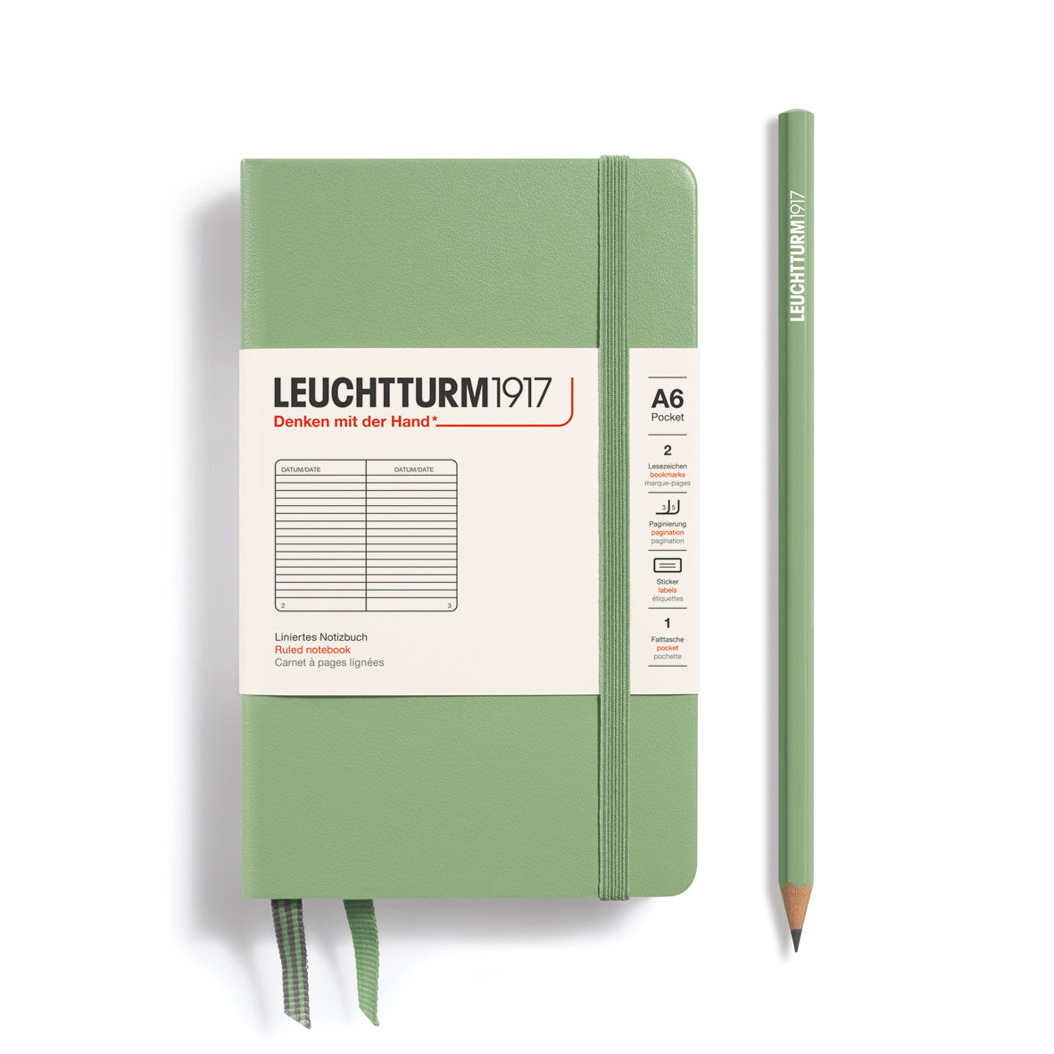 Green notebook with a pencil on a white background, featuring Leuchtturm1917 branding.