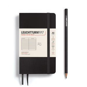 Black notebook with beige label and a pencil on a white background, featuring Leuchtturm1917 branding.