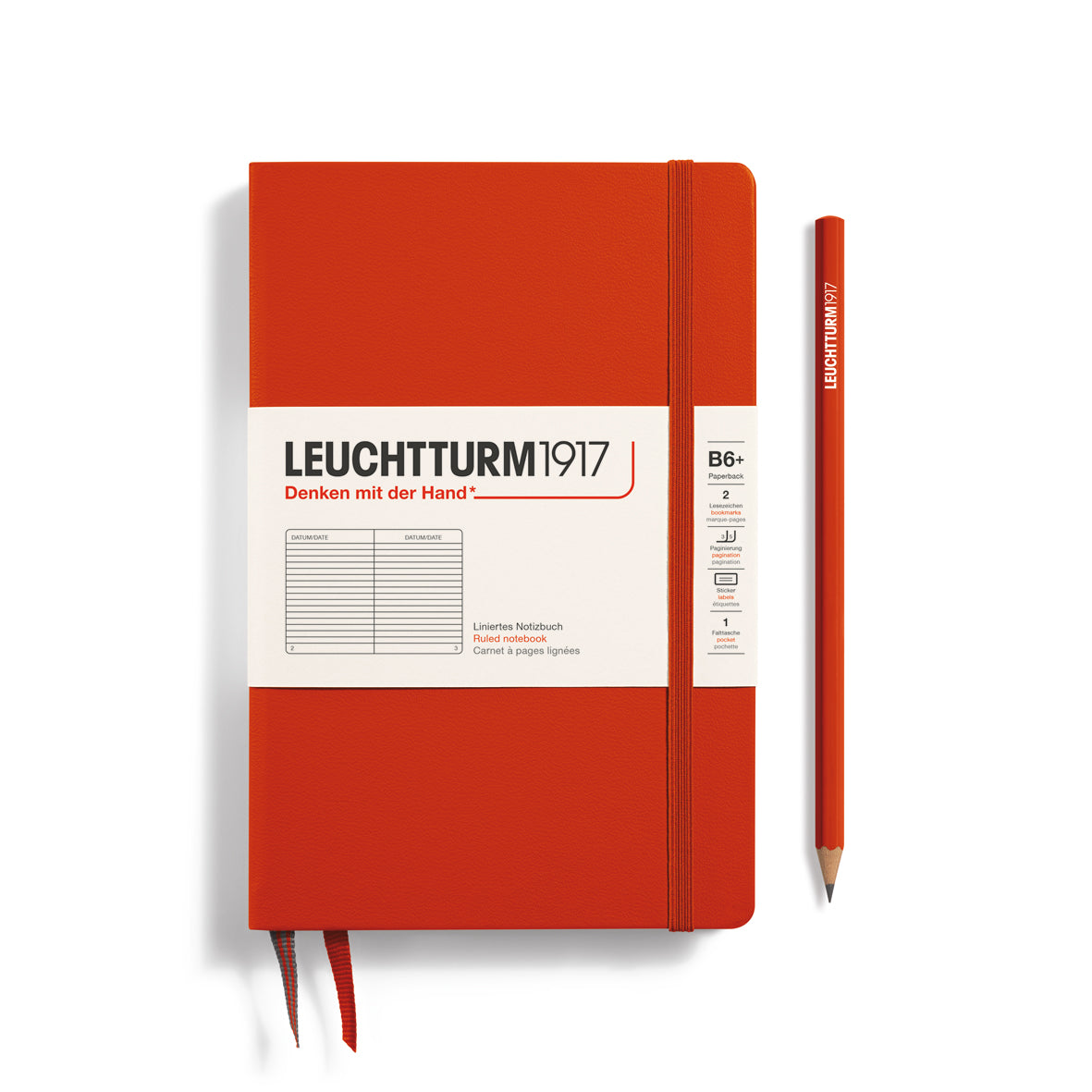 Red notebook with white label and pencil on a white background, featuring Leuchtturm1917 branding.