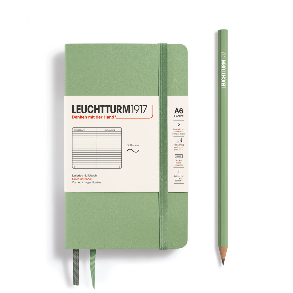 Green notebook and pencil with Leuchtturm1917 branding on a white background