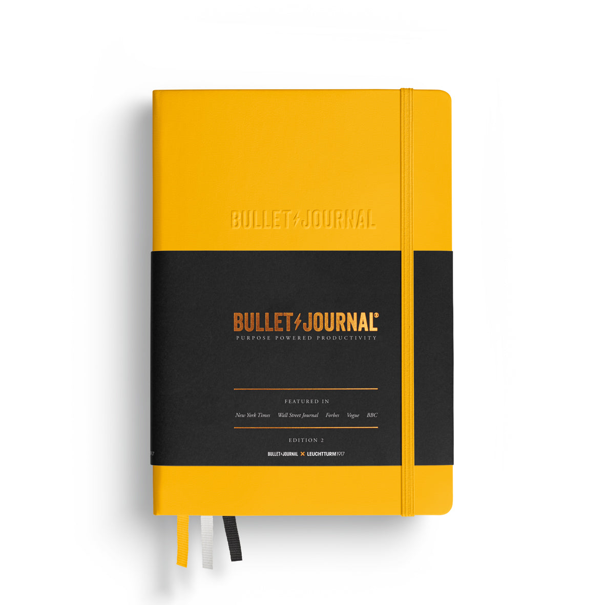Yellow Bullet Journal notebook on a white background