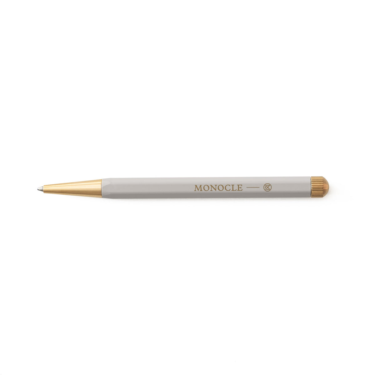 Pen with gold accents and 'MONOCLE' branding on a white background