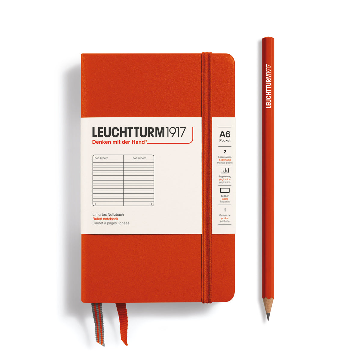 Orange notebook with a pencil on a white background, featuring Leuchtturm1917 branding.