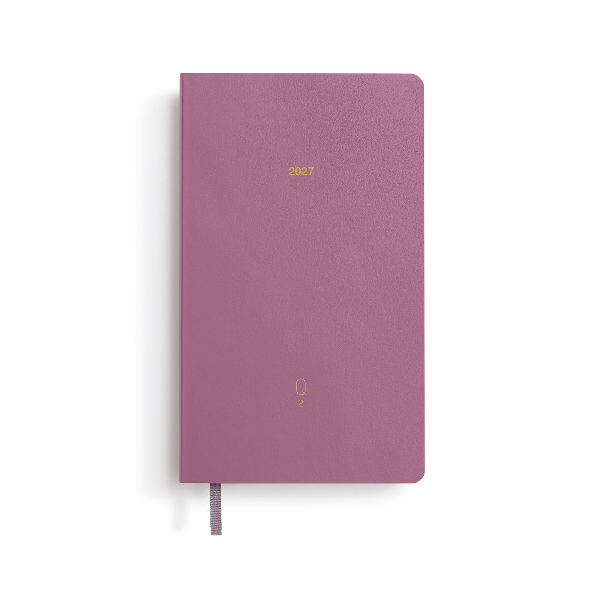 Purple notebook with '2023' printed on a white background