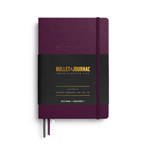 Purple26 Bullet Journal notebook with paper band, on a white background