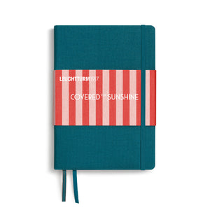 Teal notebook with red and white striped design on a white background
