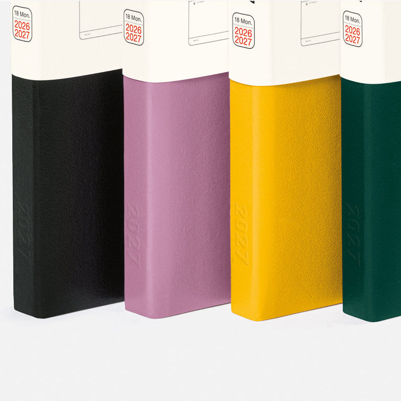 Colorful notebooks and pens on a white background