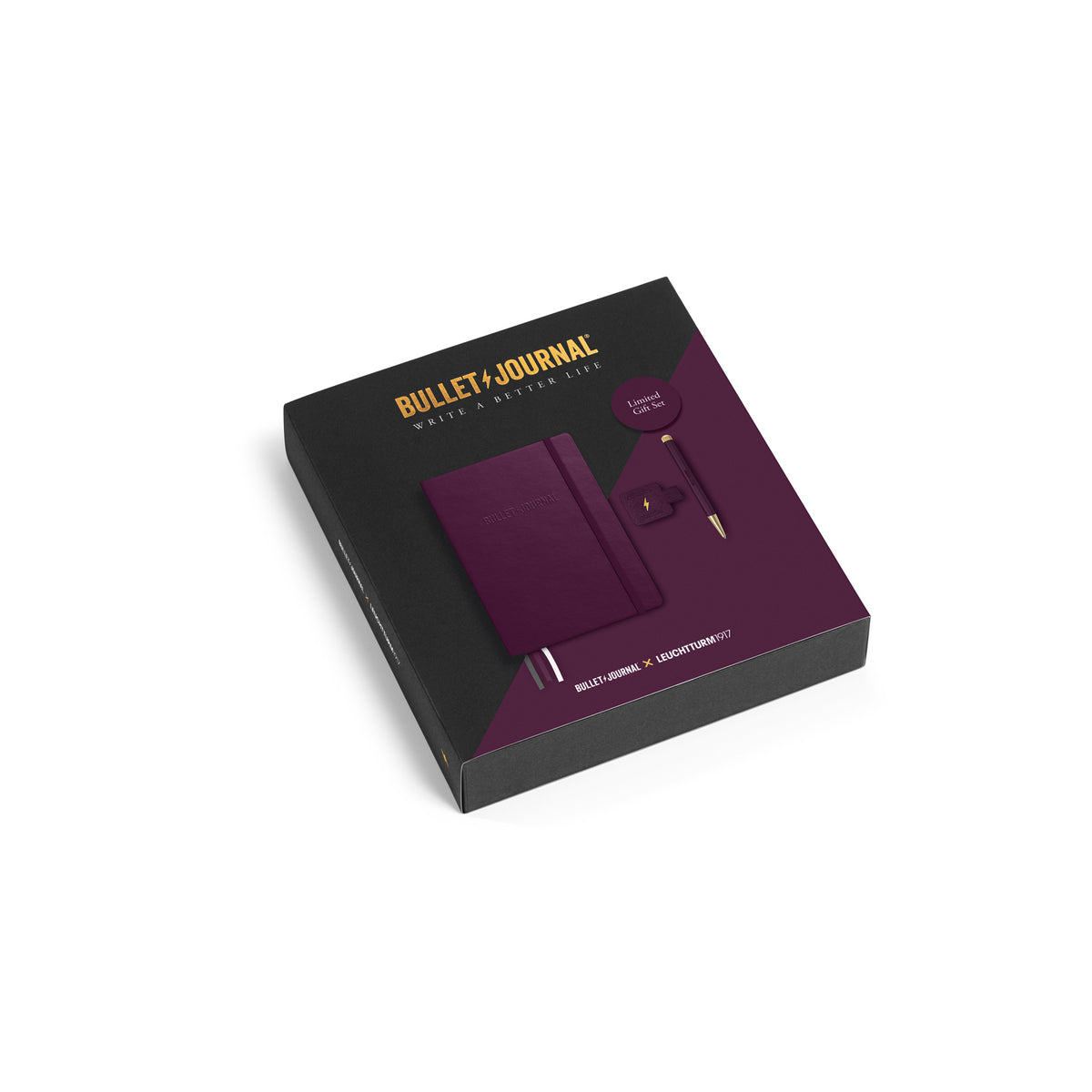 Bullet Journal gift set in a black box with gold lettering, showing a purple notebook, Drehgriffel pen and pen loop, on a white background