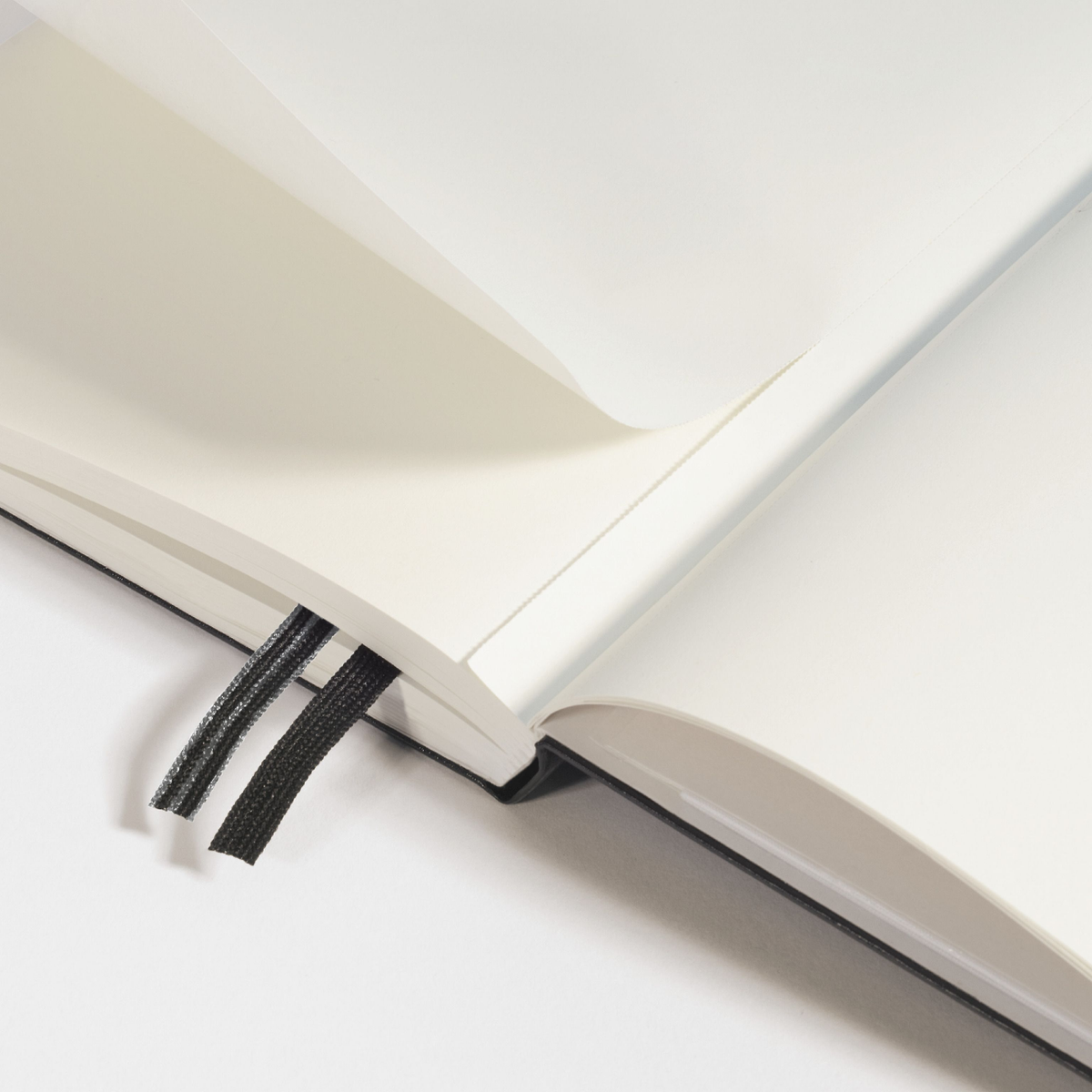Open book with a bookmark on a white background