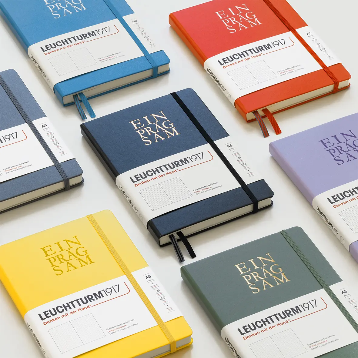 Collection of colorful notebooks with 'Leuchtturm1917' branding on a white background