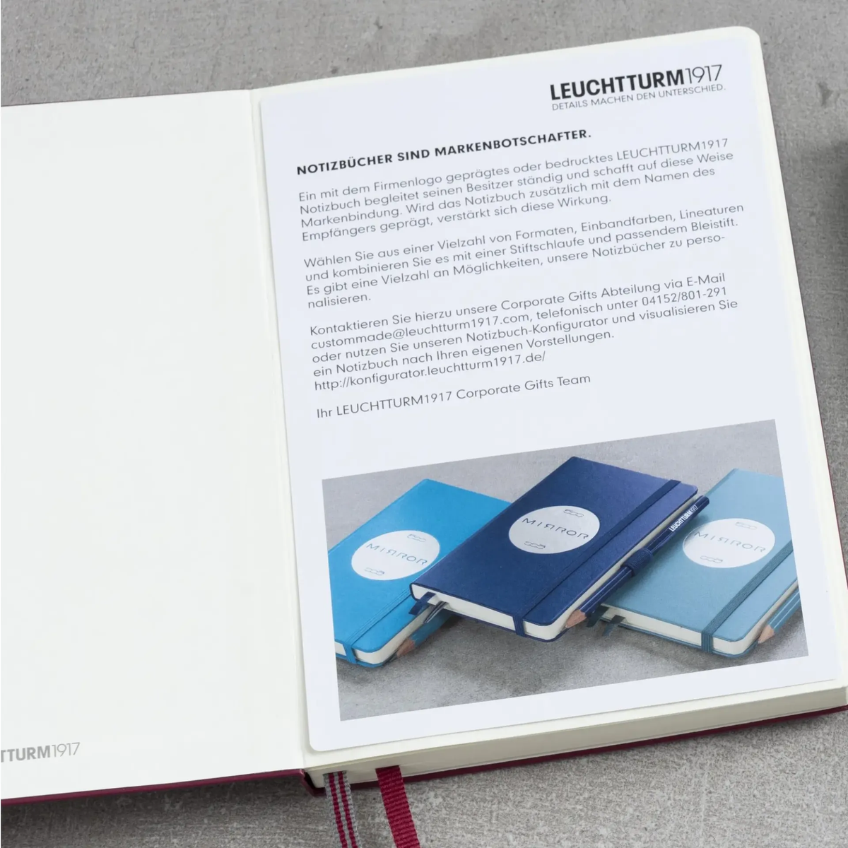 Open notebook displaying a page with Leuchtturm1917 branding and product images.