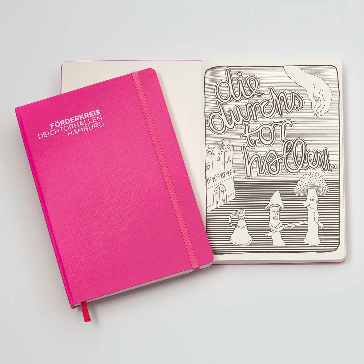 Pink notebook with a white cover featuring text and illustrations on a light gray background