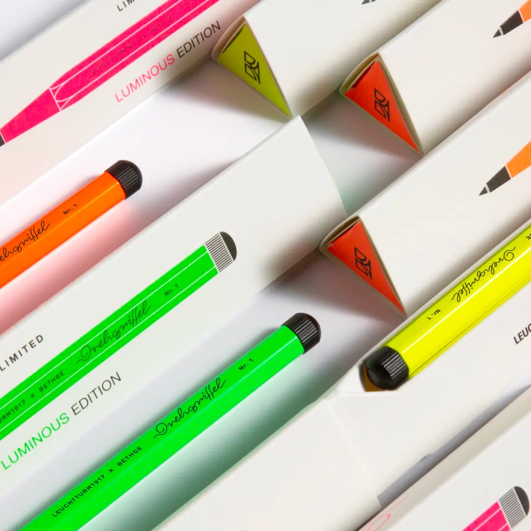 Colorful markers with 'Luminous Edition' text on white background