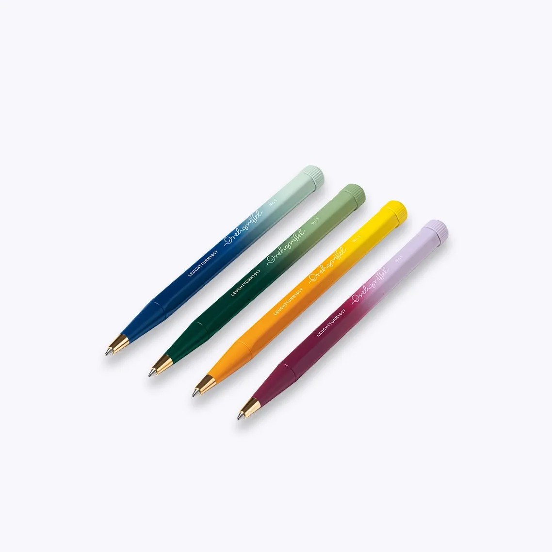 Four colorful pens on a light gray background