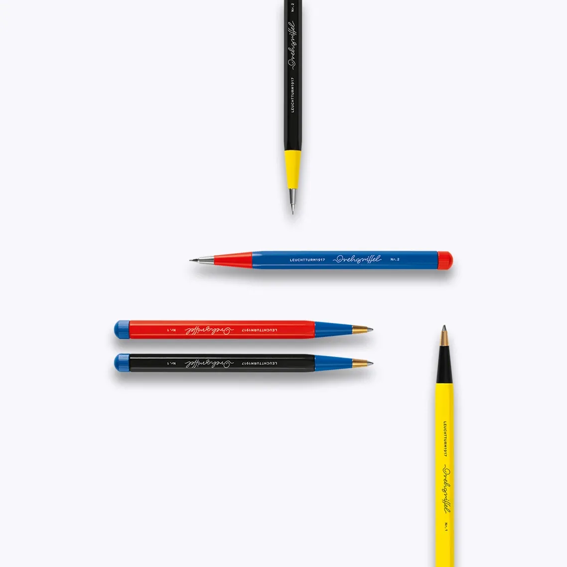 Collection of pens and pencils on a white background