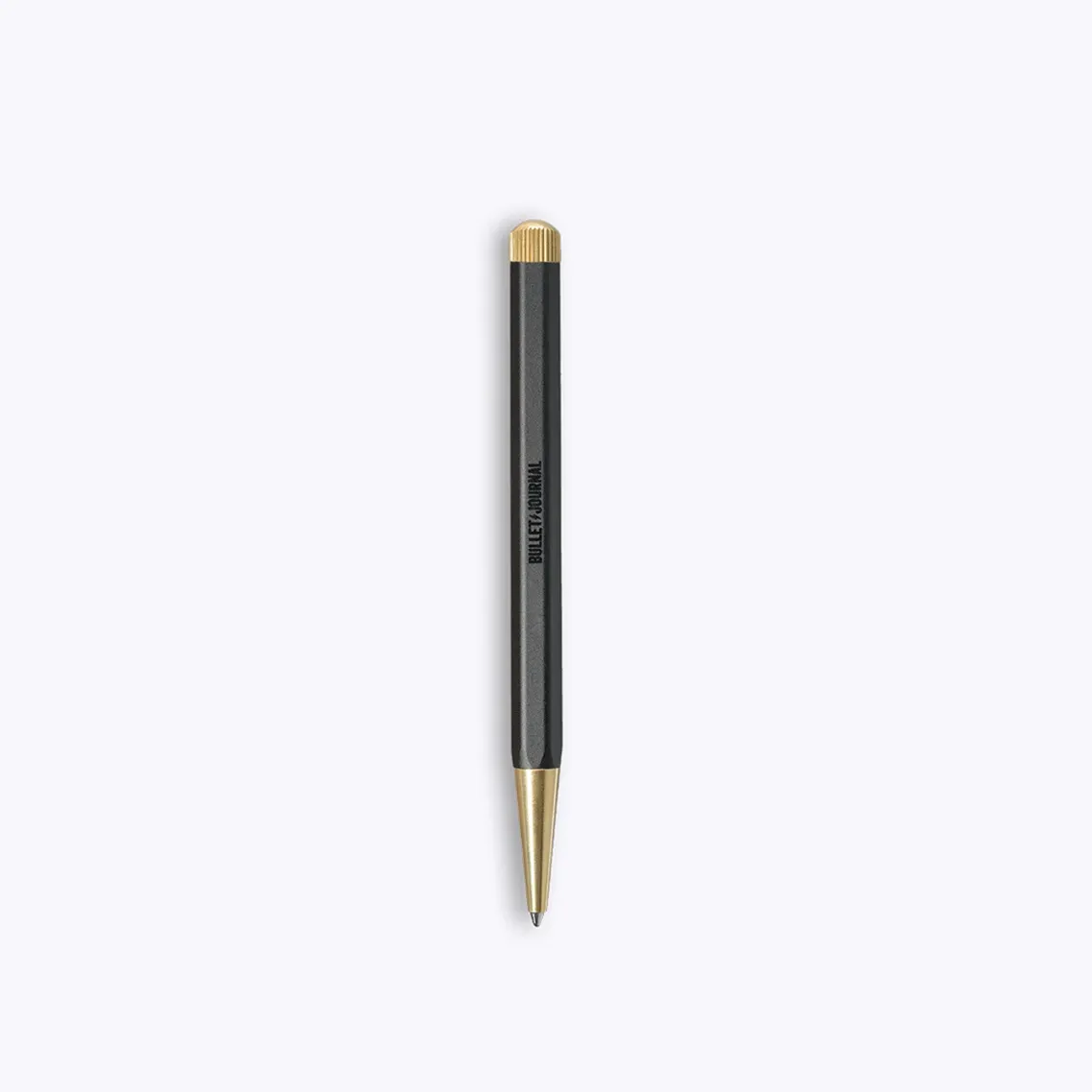 Metallic black pen with gold accents on a white background.