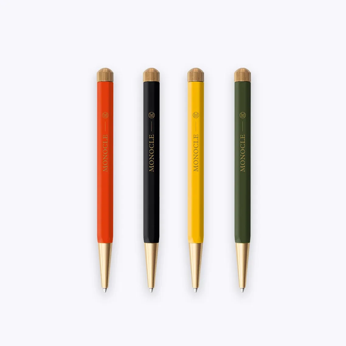 Four pens with different colored bodies and gold accents on a white background