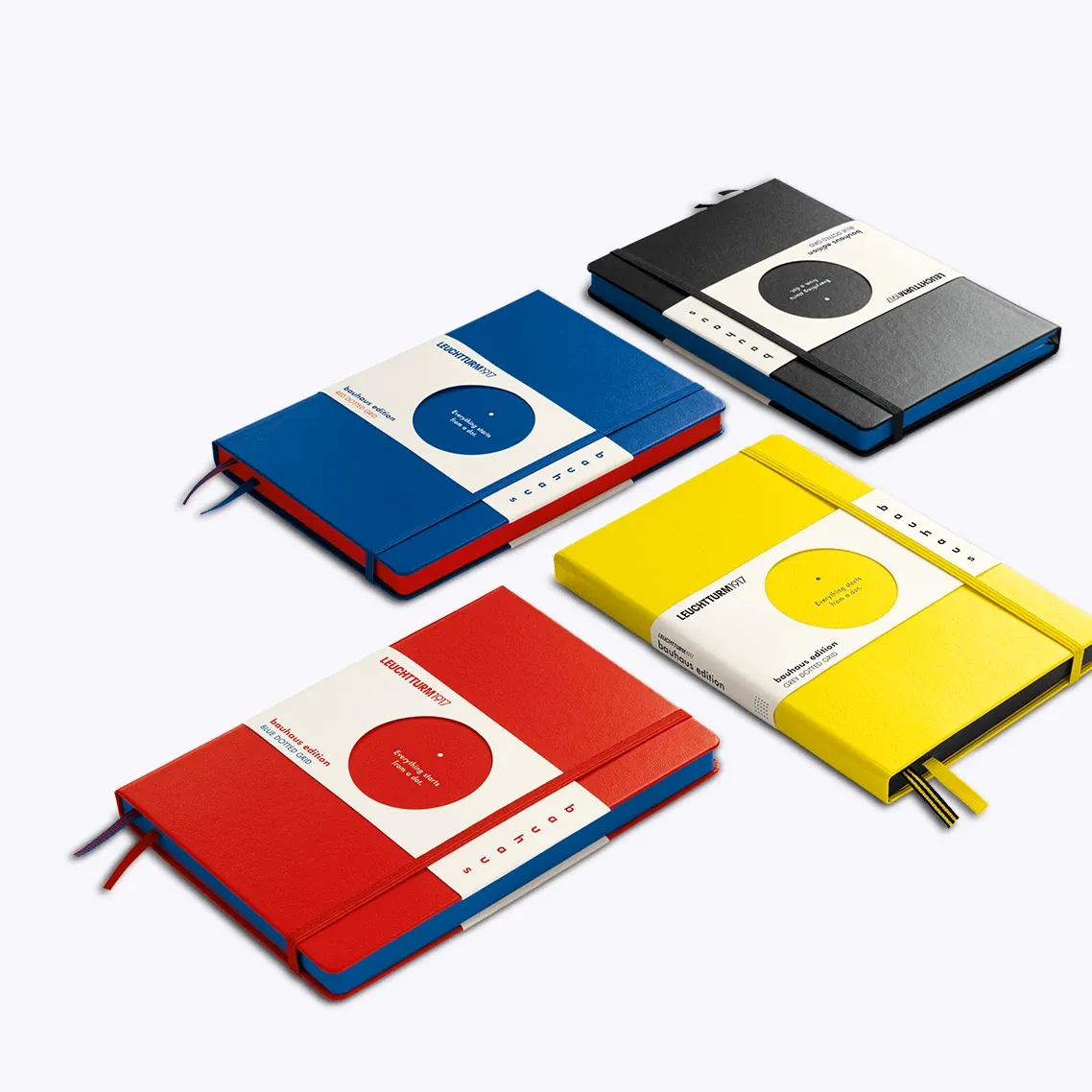 Four colorful notebooks with a white background