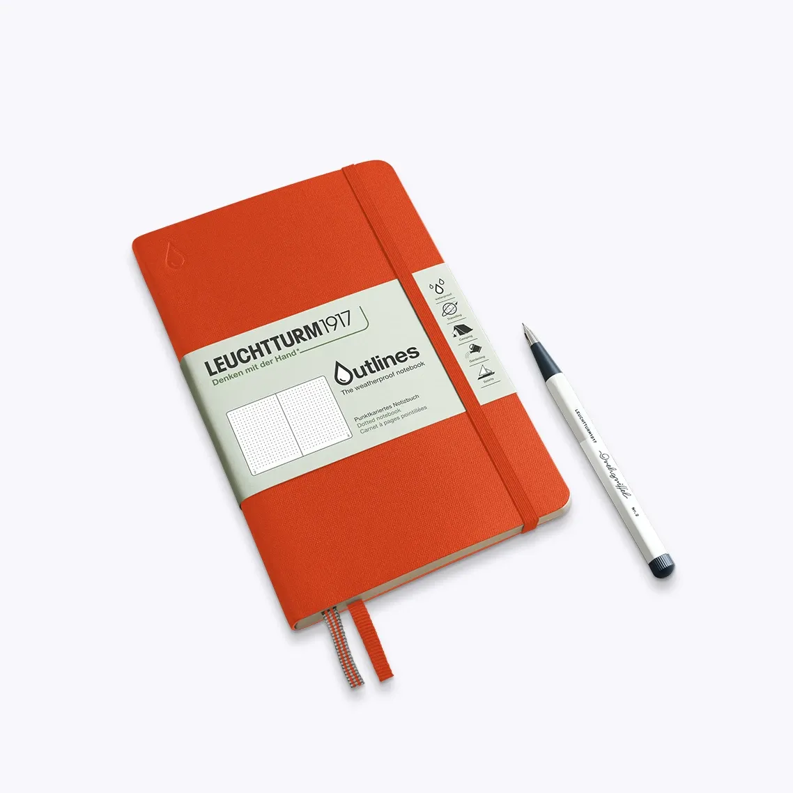 Orange notebook with a pen on a white background
