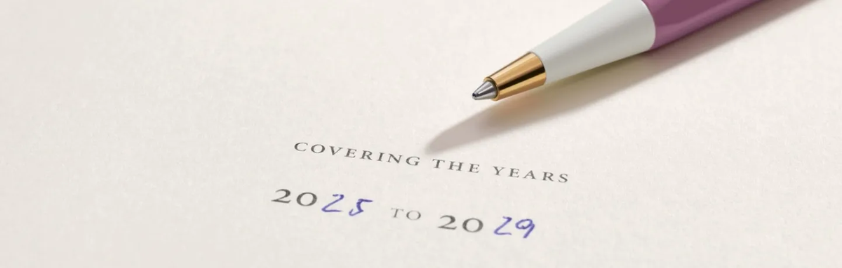 Pen and paper with text 'Covering the Years 2025 to 2029' on a light background