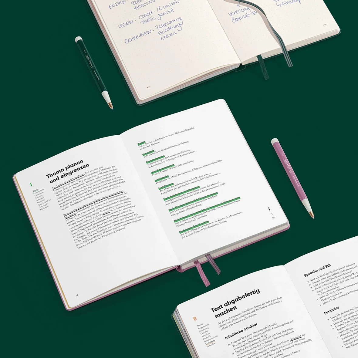 Open books with notes and a pen on a green background