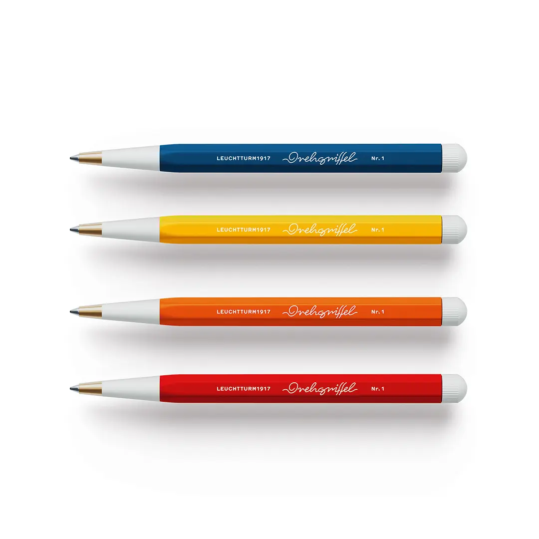 Four pens with different colored barrels on a white background