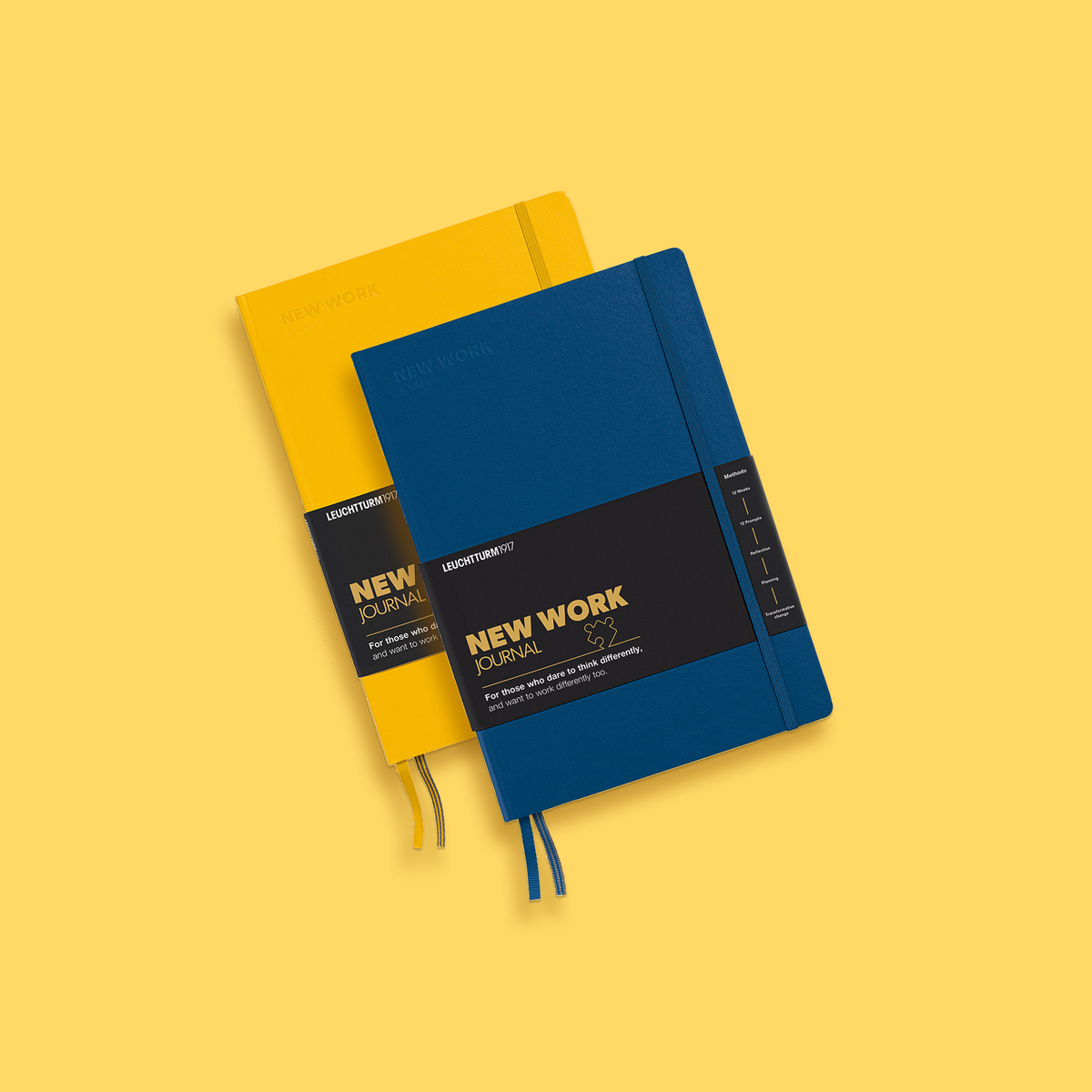 Two notebooks, one blue and one yellow, on a yellow background