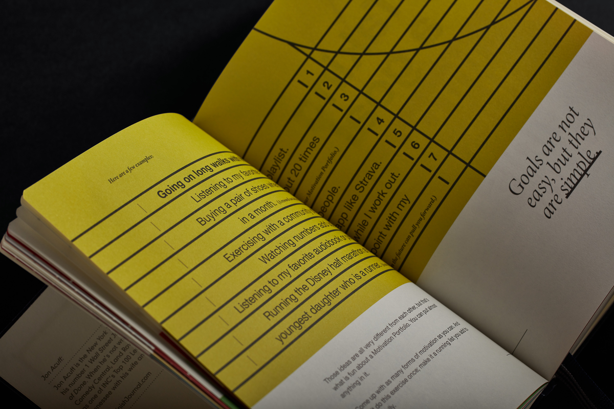 Open book with yellow pages and text on a black background