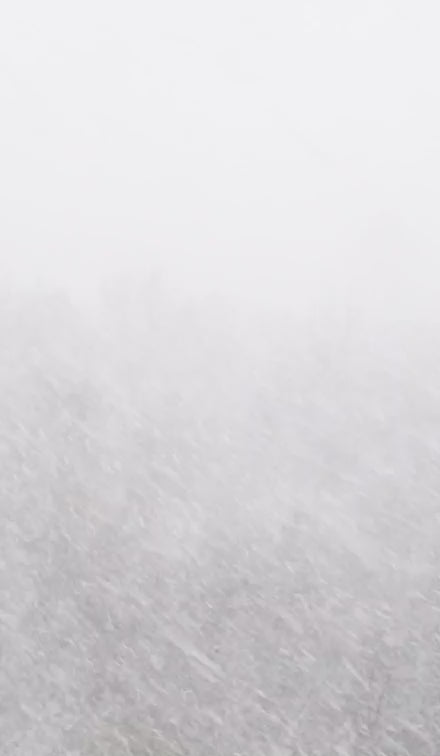 Video of people in snow and then panning to talking about how they use notebooks.