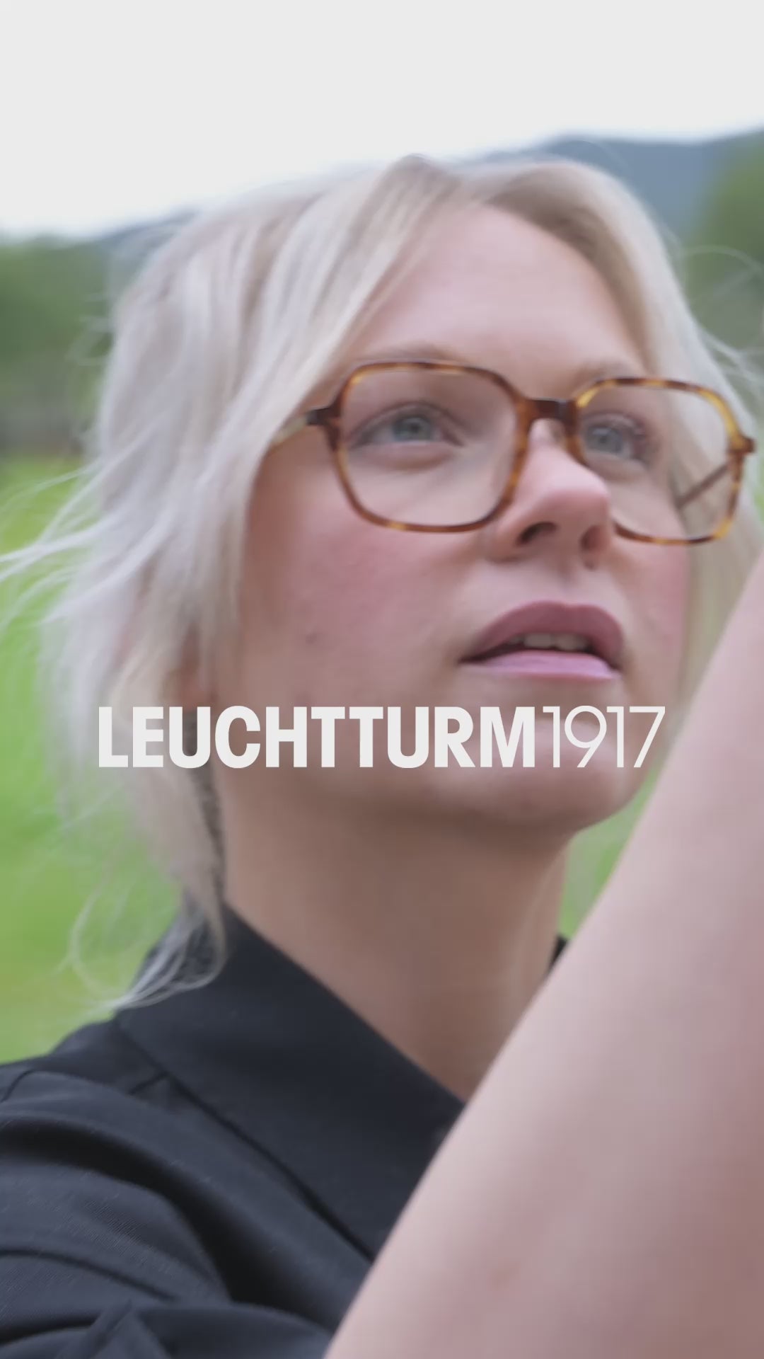 Video of artist talking and sketching in a notebook in an outdoor setting